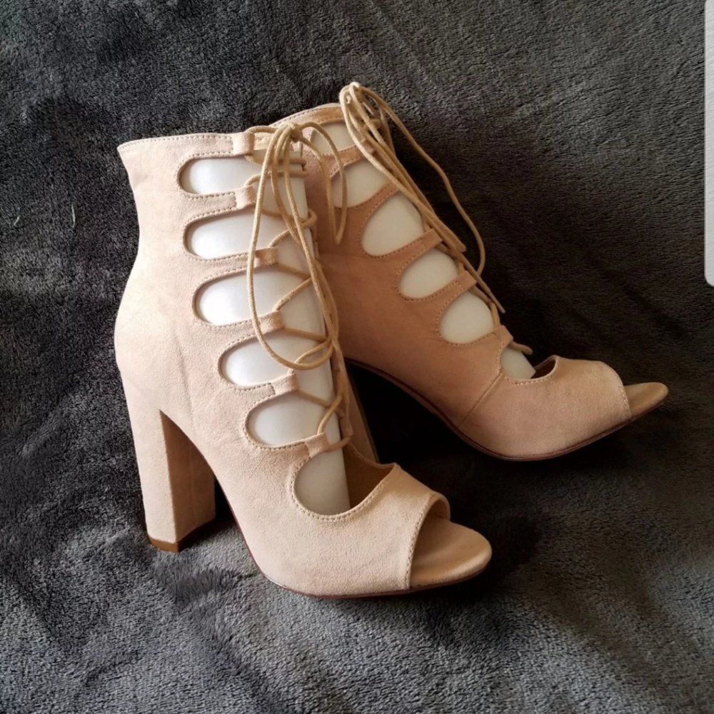 Laced up nude peep toe heels